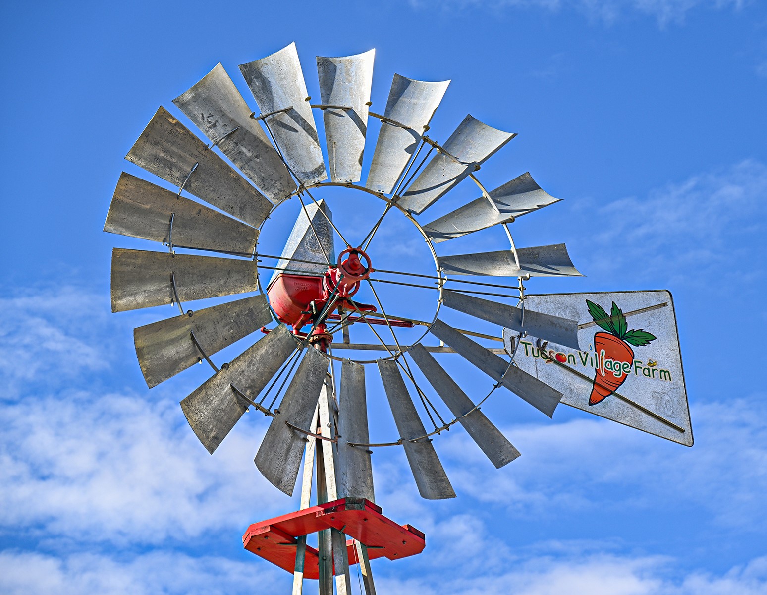 A closeup of a windmill at ߲о Village Farm.