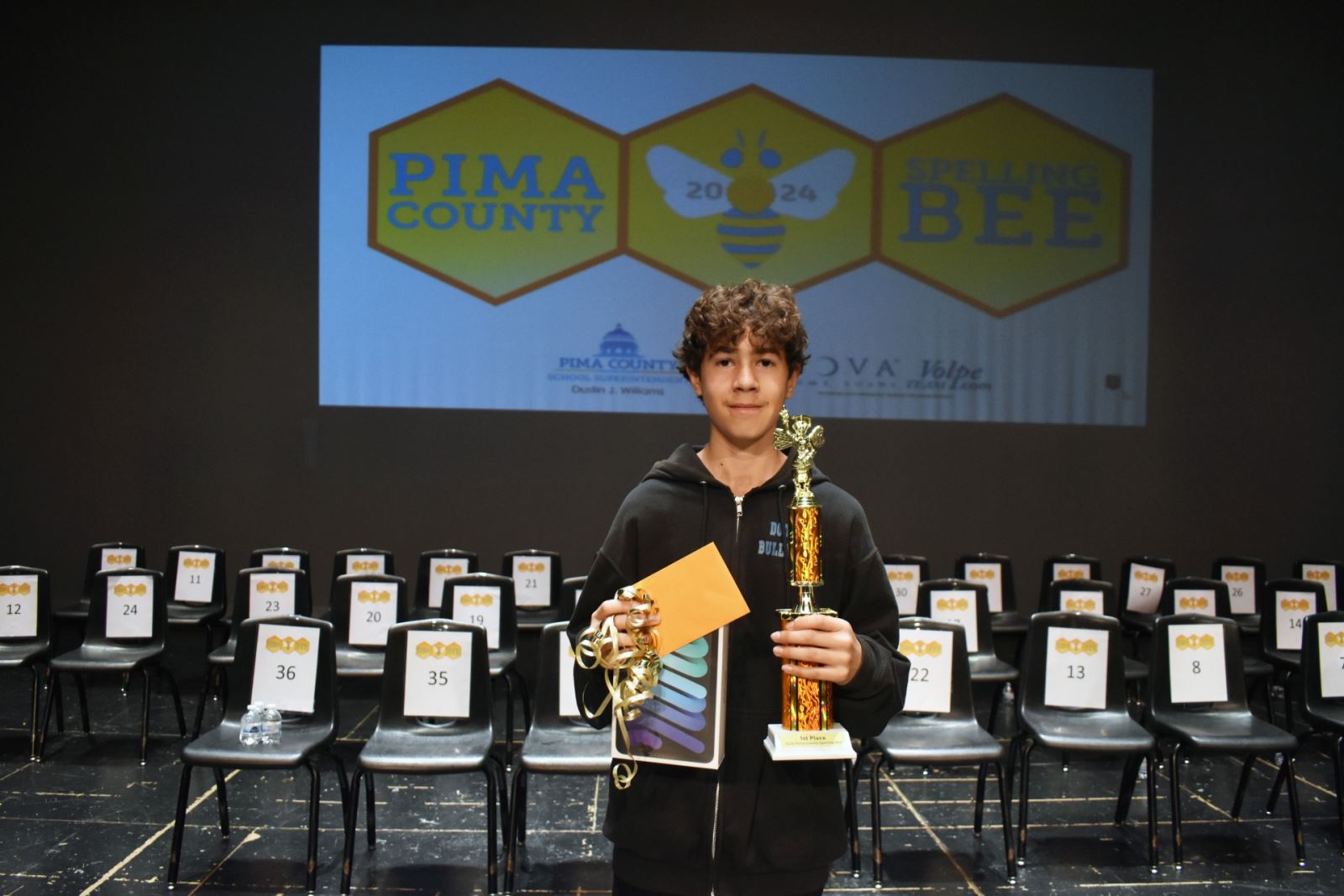 Ricardo Cabrera poses with his trophy for winning the Pima County Spelling Bee!